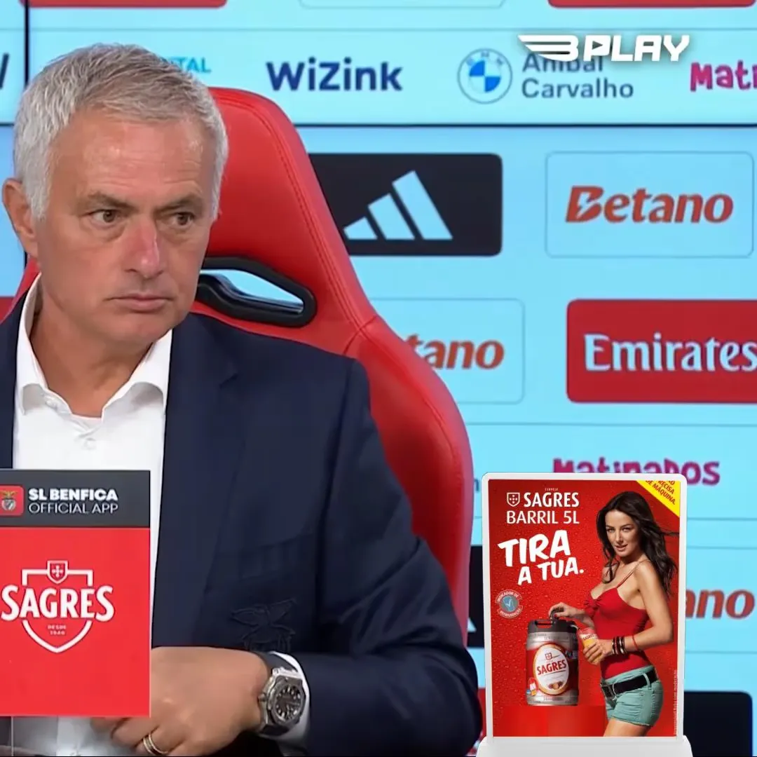 Branded ad boards displayed behind a live post-match press conference